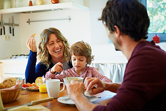 Family eating breakfast together